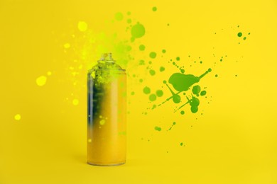 Image of Can of spray paint and splatters on yellow background