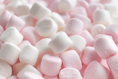 Delicious puffy pink and white marshmallows as background, closeup