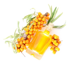 Photo of Natural sea buckthorn oil and fresh berries on white background, top view