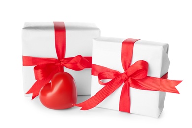 Photo of Beautiful gift boxes and red heart on white background. Valentine's day celebration