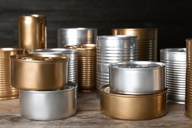 Many tin cans on table. Recycling garbage