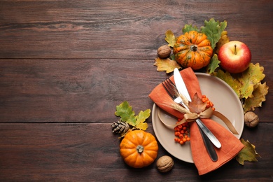 Photo of Festive table setting on wooden background, flat lay with space for text. Thanksgiving Day celebration