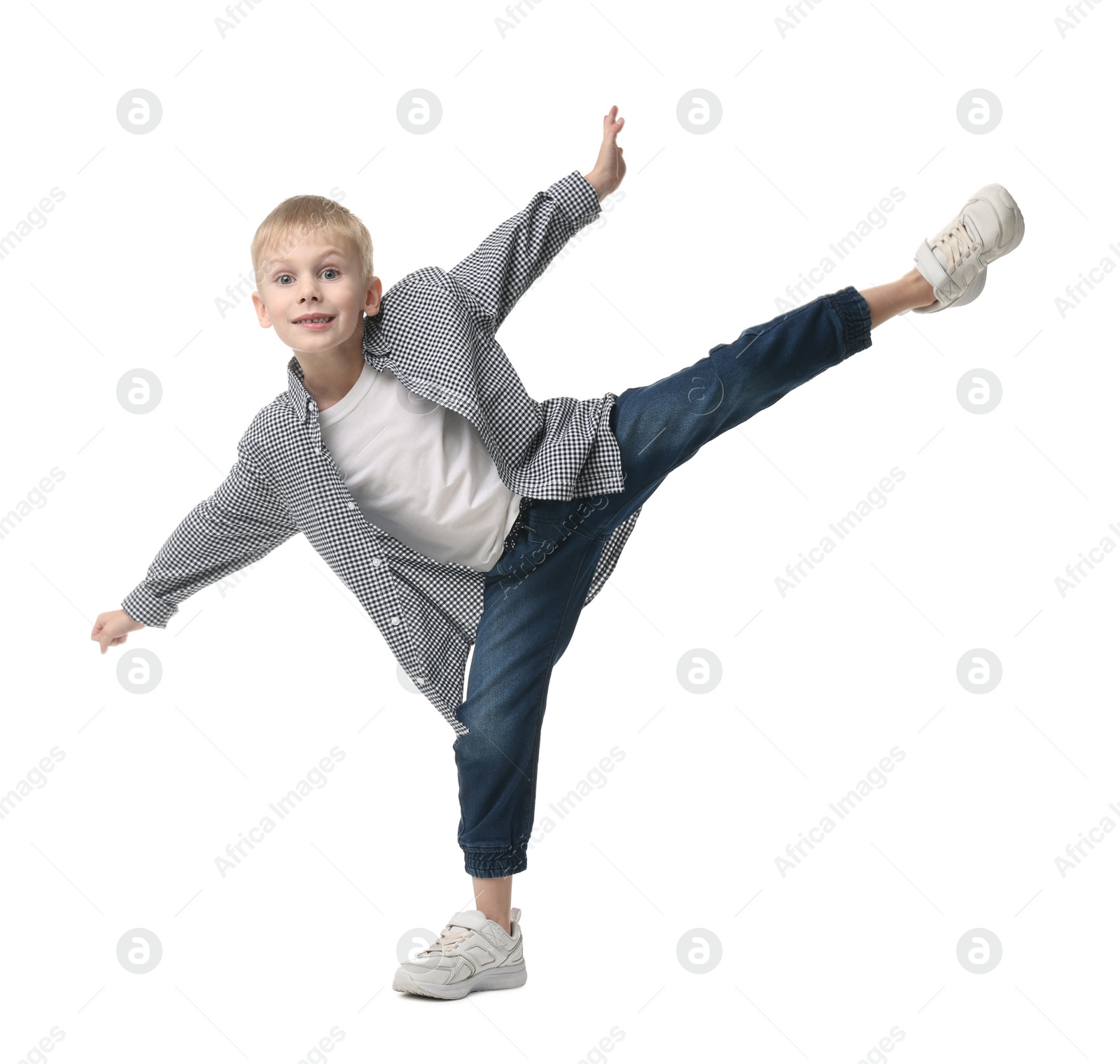 Photo of Happy little boy dancing on white background