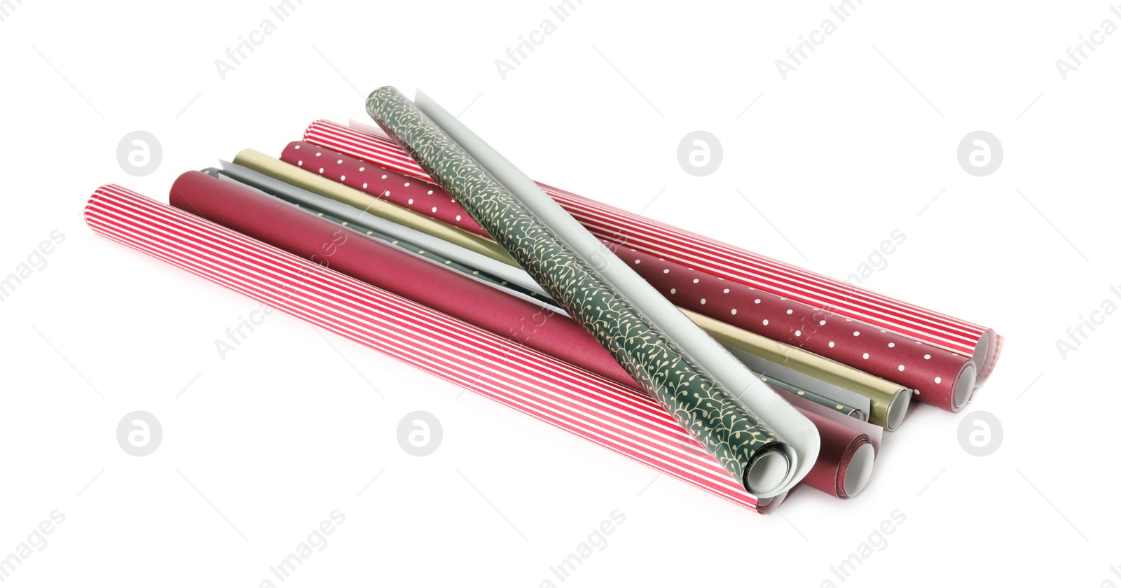 Photo of Different colorful wrapping paper rolls on white background