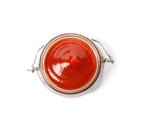 Photo of Tasty homemade tomato sauce in glass jar on white background, top view