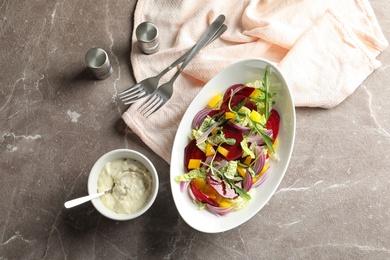 Photo of Flat lay composition with tasty beets salad on table