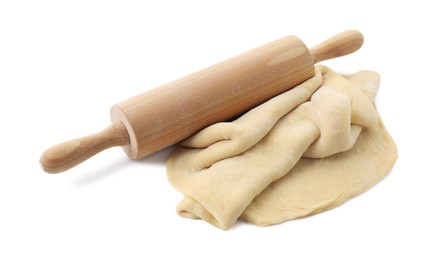 Photo of Raw dough and rolling pin isolated on white