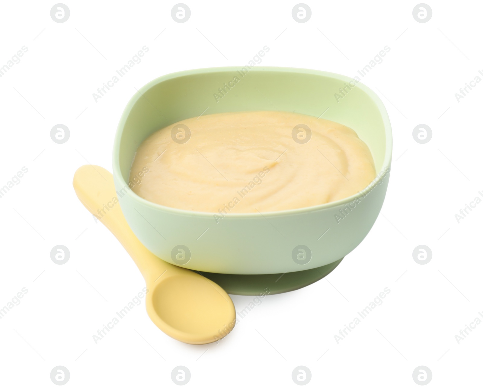 Photo of Tasty baby food in bowl and spoon isolated on white