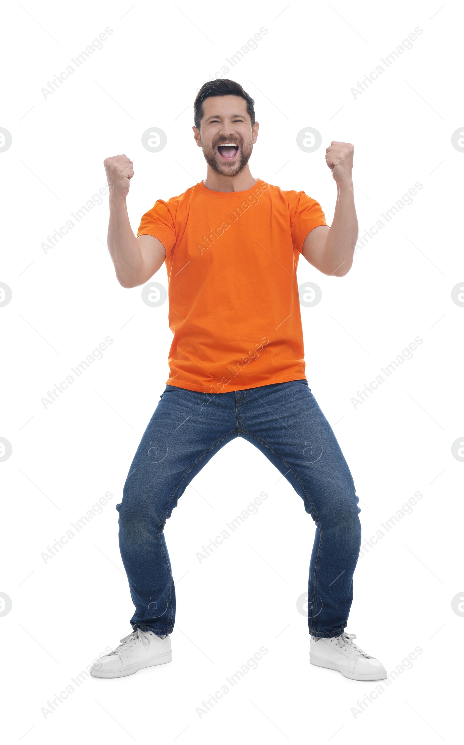 Photo of Emotional sports fan celebrating on white background