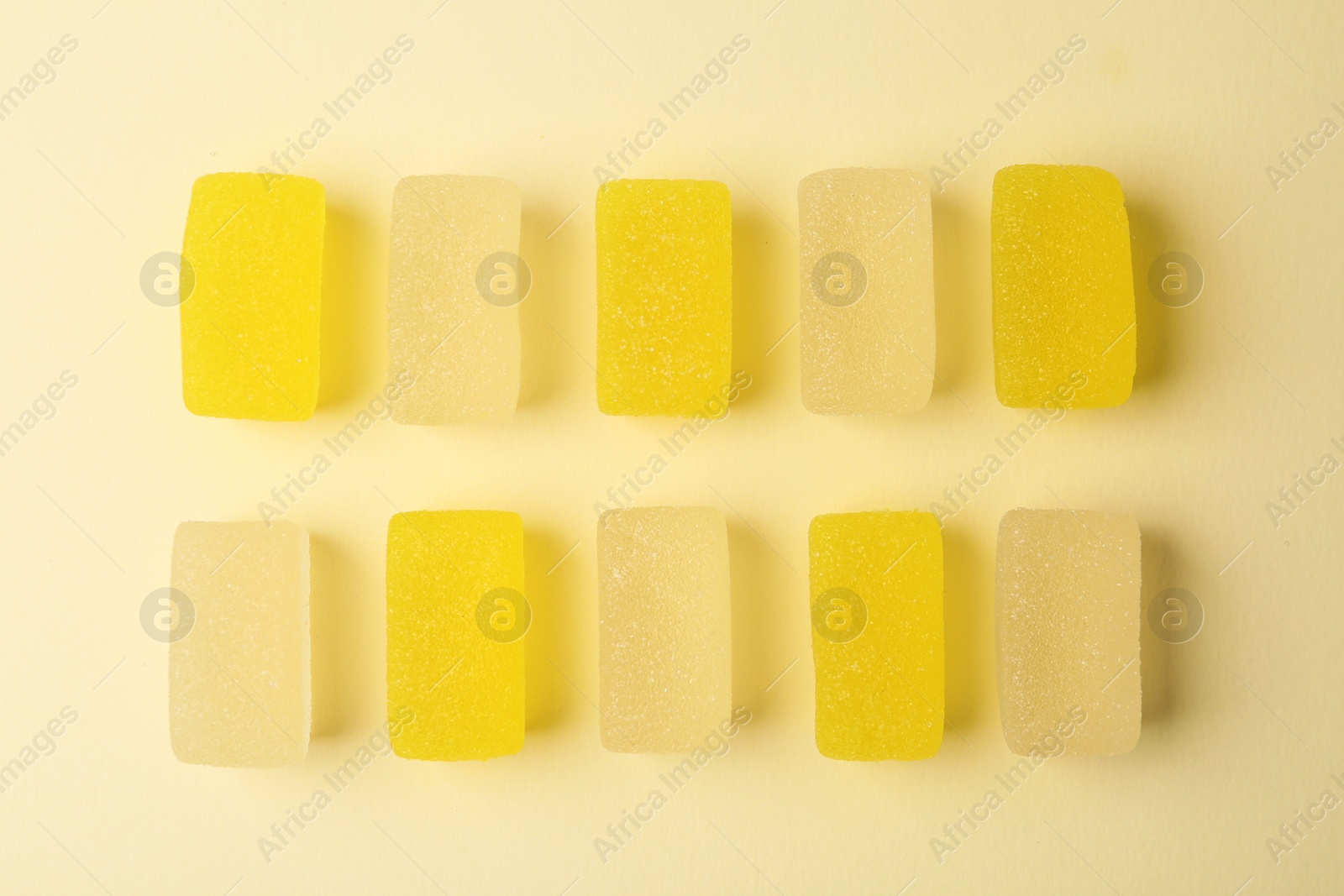 Photo of Assorted tasty jelly candies on color background, flat lay