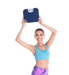Photo of Happy young woman with scales on white background. Weight loss motivation