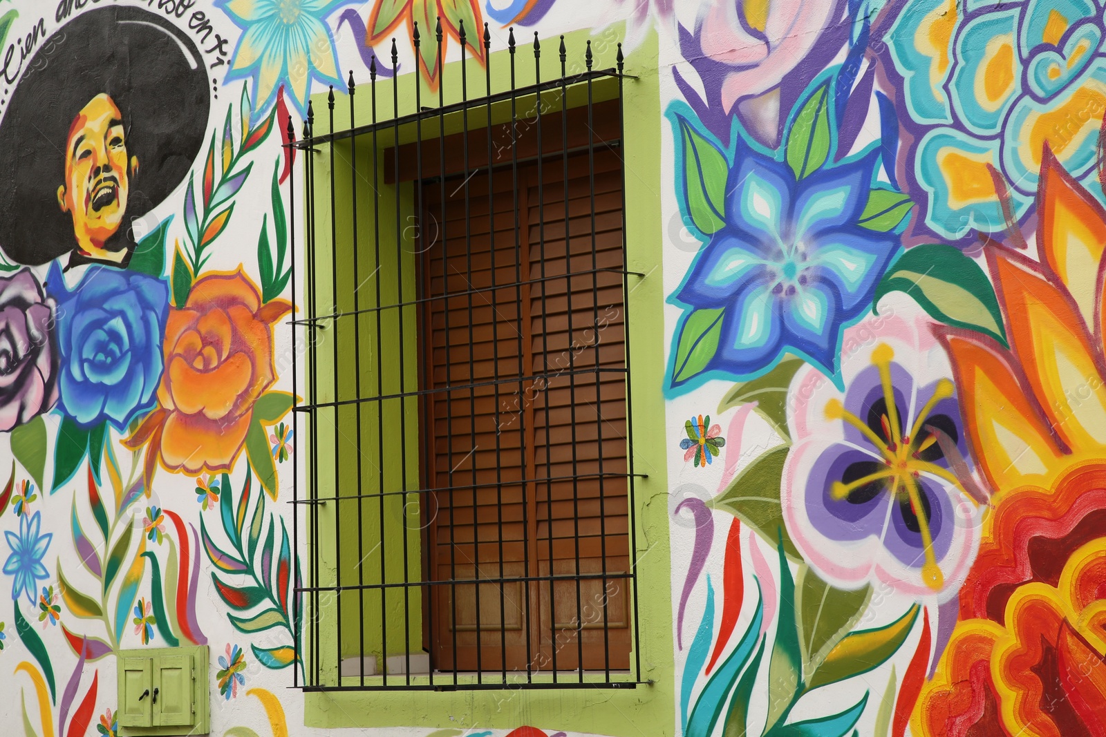 Photo of San Pedro Garza Garcia, Mexico – February 8, 2023: Building with beautiful traditional street art and window