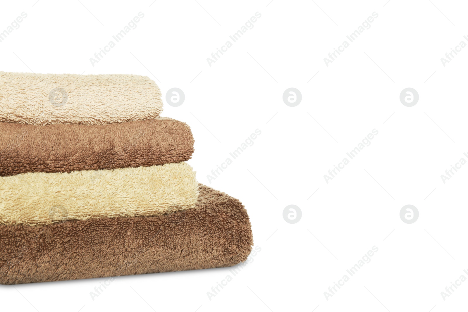 Photo of Folded soft terry towels on white background