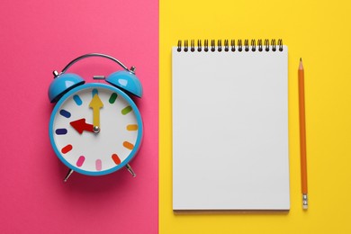 Photo of Alarm clock, pencil and blank notebook on color background, flat lay with space for text. Reminder concept