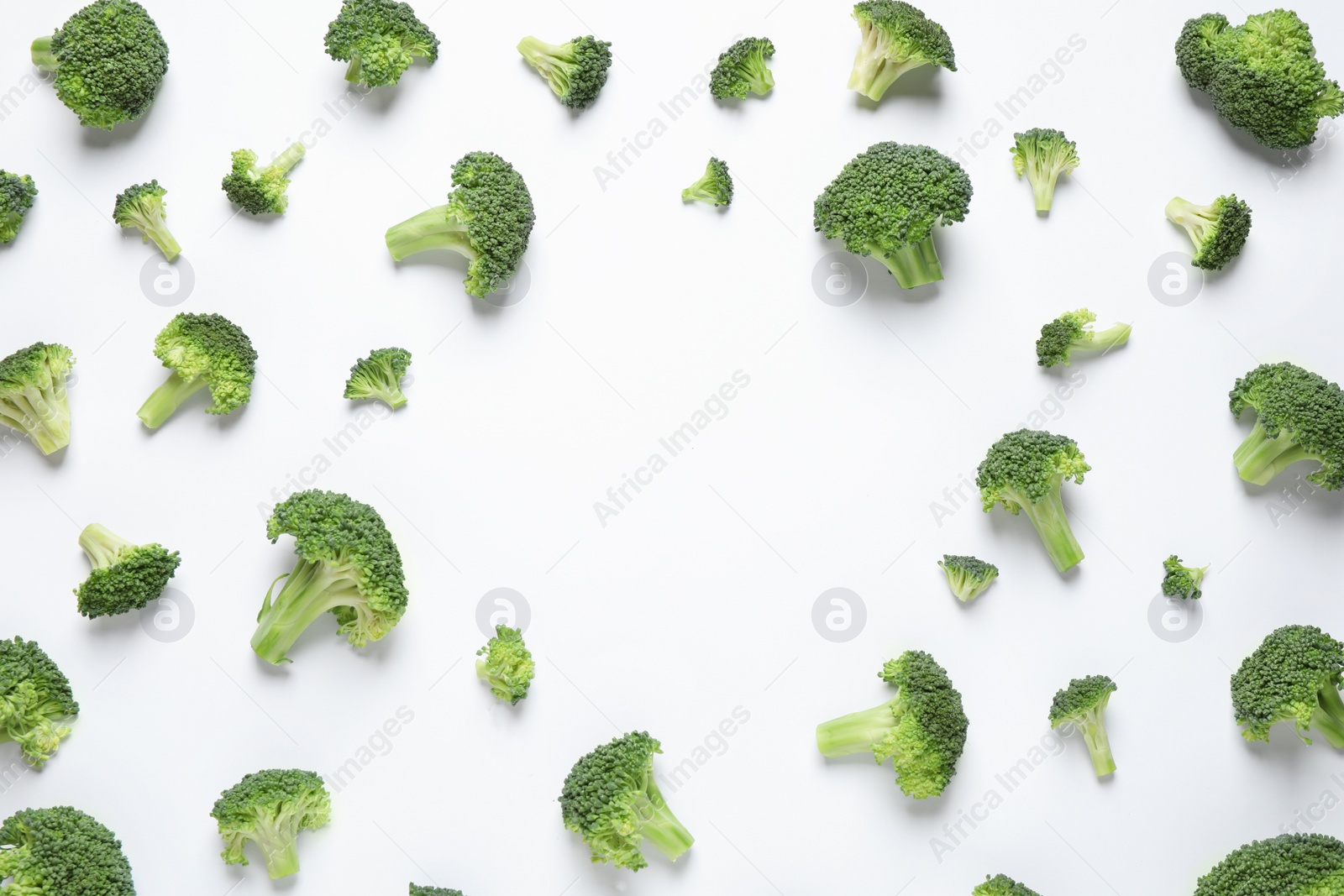 Photo of Fresh tasty broccoli on white background, top view