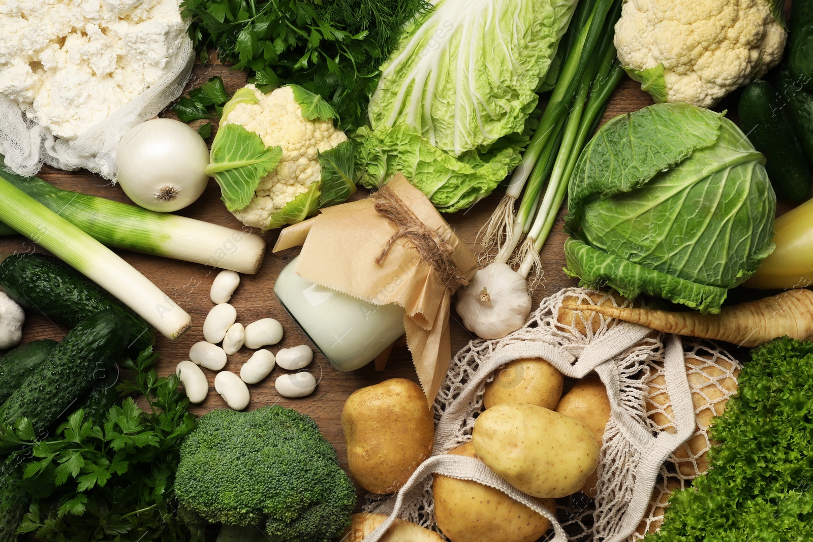 Photo of Different fresh farm products on wooden table, flat lay