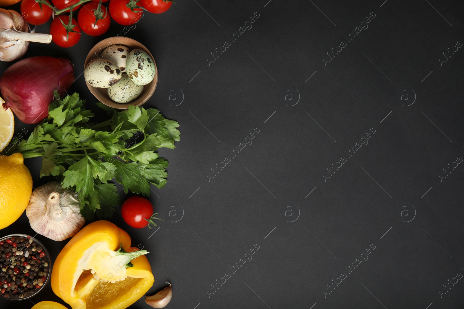 Photo of Flat lay composition with ingredients for cooking on black background. Space for text