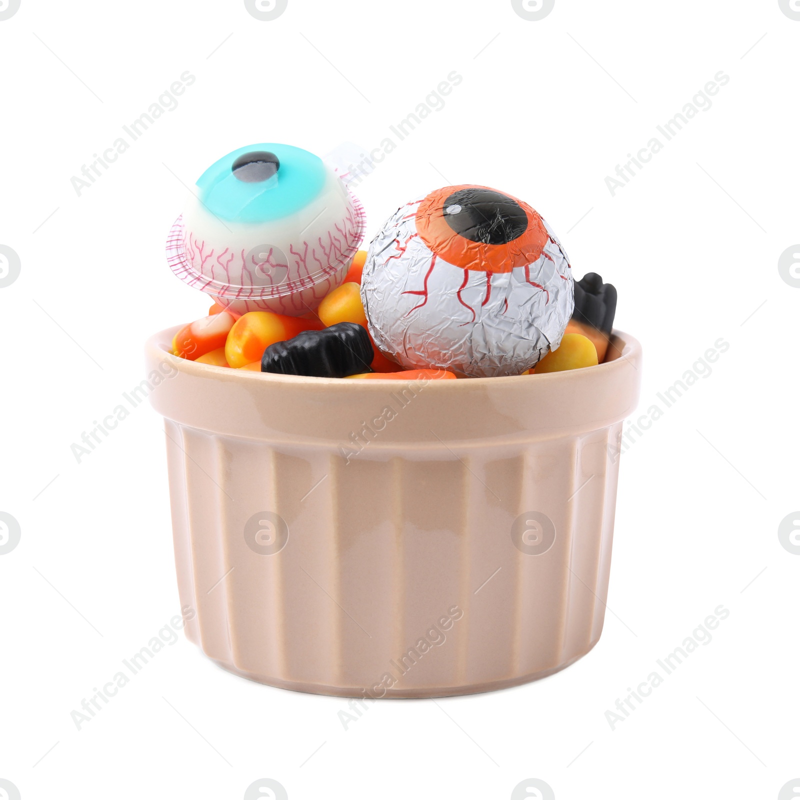 Photo of Bowl of delicious colorful candies isolated on white. Halloween sweets