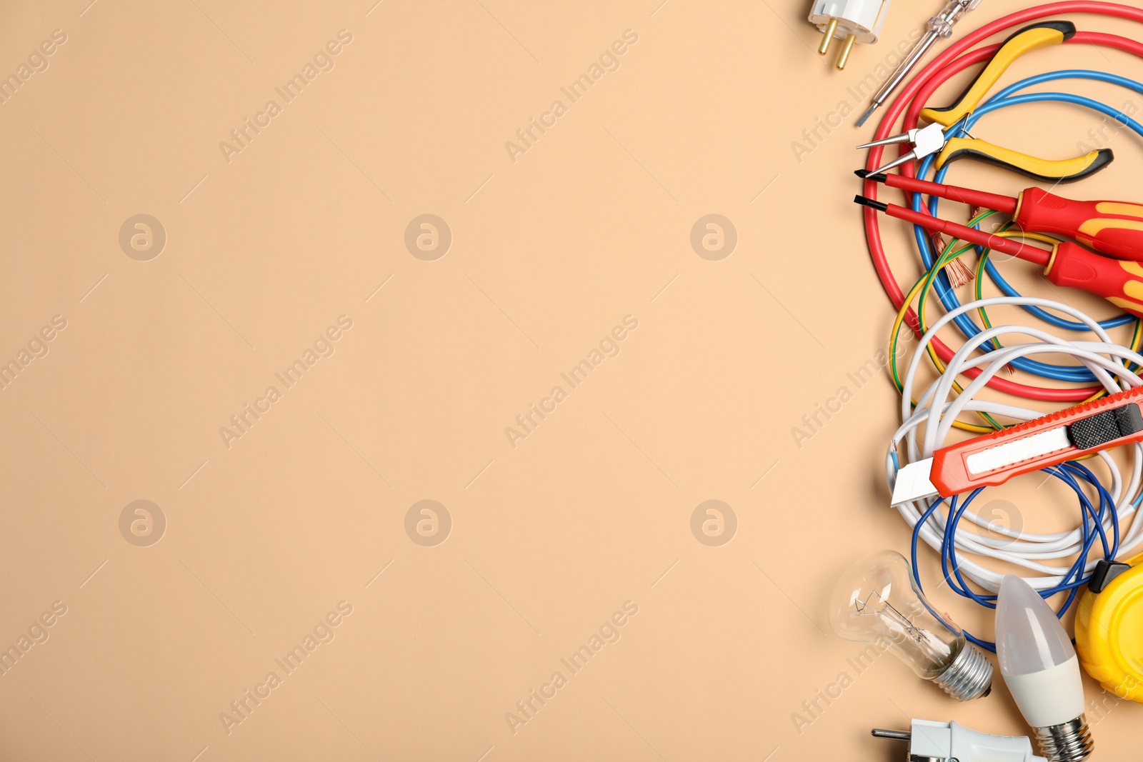 Photo of Flat lay composition with electrician's tools and space for text on color background