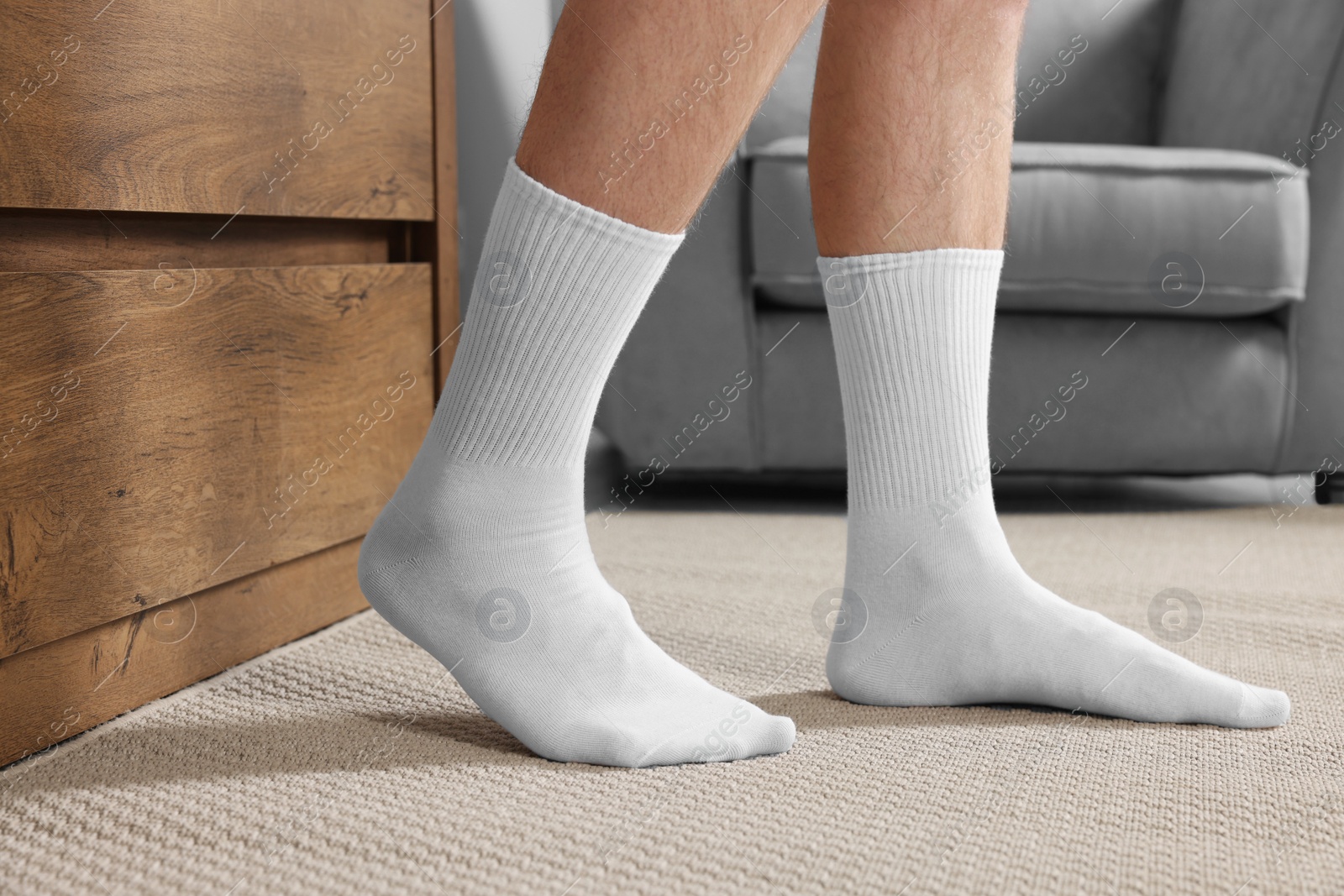 Photo of Man in stylish white socks indoors, closeup