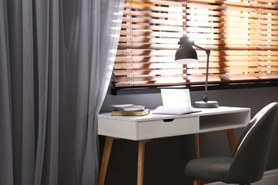 Beautiful curtains on window in stylish office interior