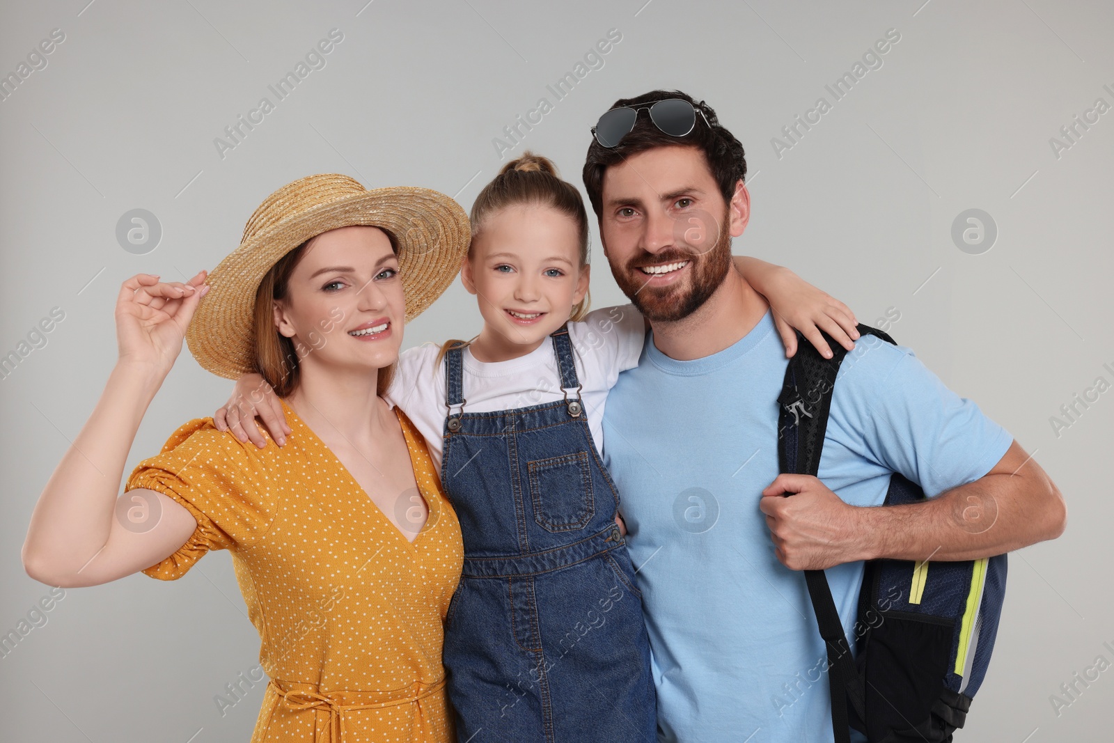 Photo of Portrait of happy family on light grey background