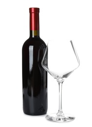 Photo of Bottle of red wine and glass on white background