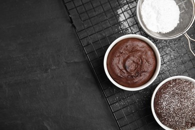 Photo of Delicious fresh chocolate fondant on black table, flat lay. Space for text