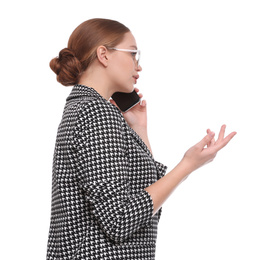 Young businesswoman talking on mobile phone against white background