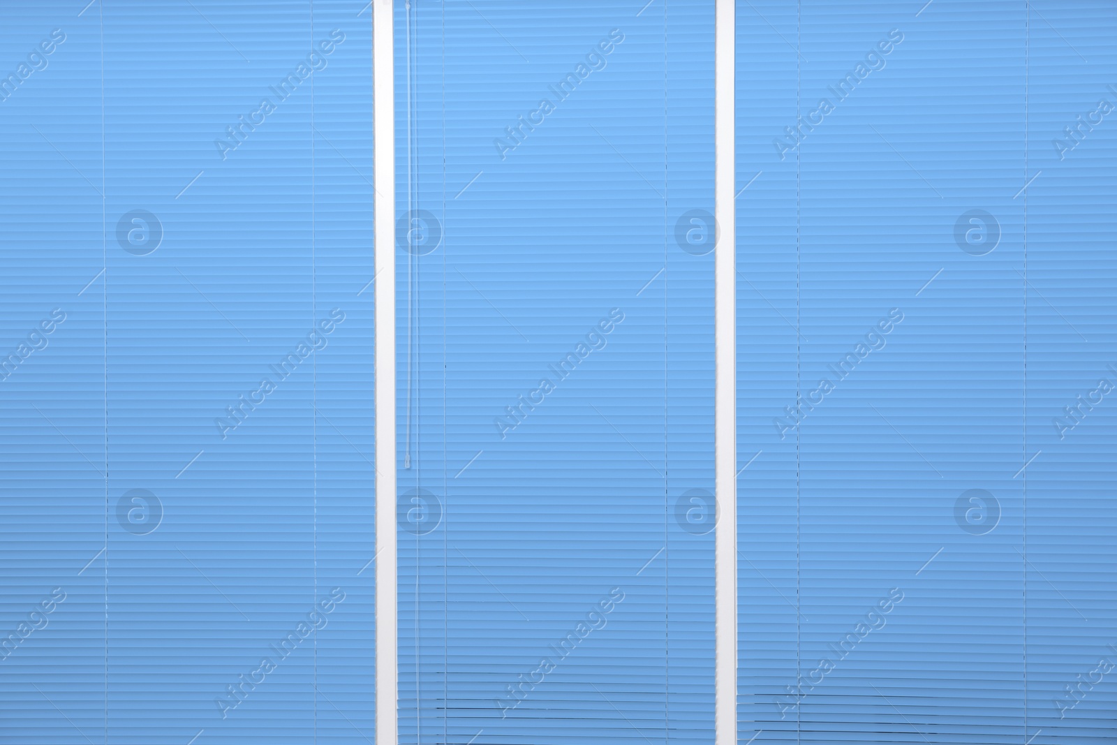 Image of Window with closed blue horizontal blinds as background