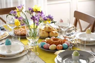 Festive Easter table setting with traditional meal at home