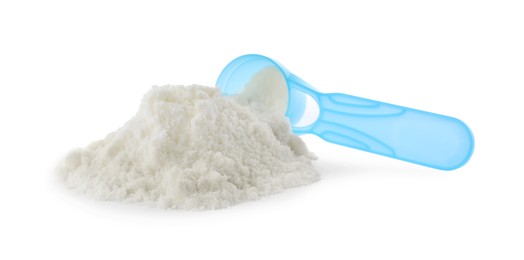 Photo of Powdered infant formula and scoop on white background. Baby milk