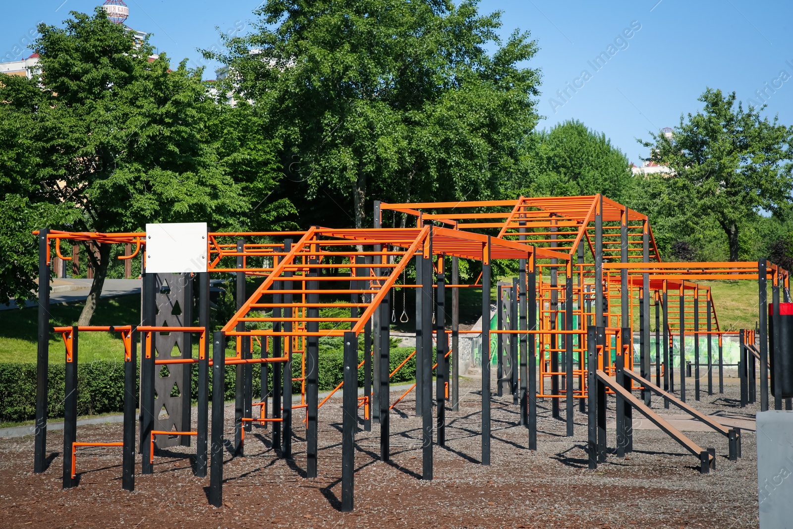 Photo of Empty outdoor gym with exercise equipment in park