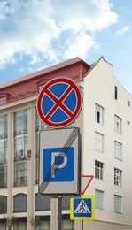 Traffic signs No Stopping and Parking Zone Ends on city street