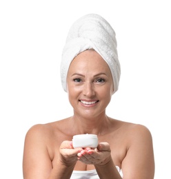 Portrait of beautiful mature woman with perfect skin holding jar of cream on white background