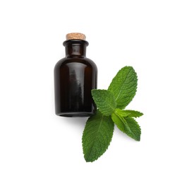 Photo of Bottle of essential oil and mint on white background, flat lay