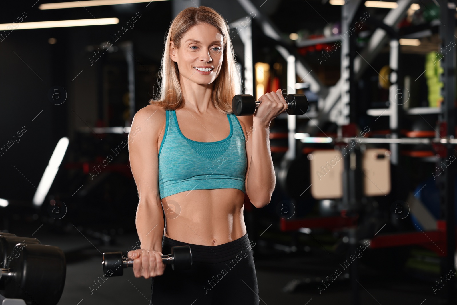 Photo of Fitness trainer recording online classes in gym