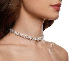 Photo of Young woman wearing elegant pearl necklace on white background, closeup
