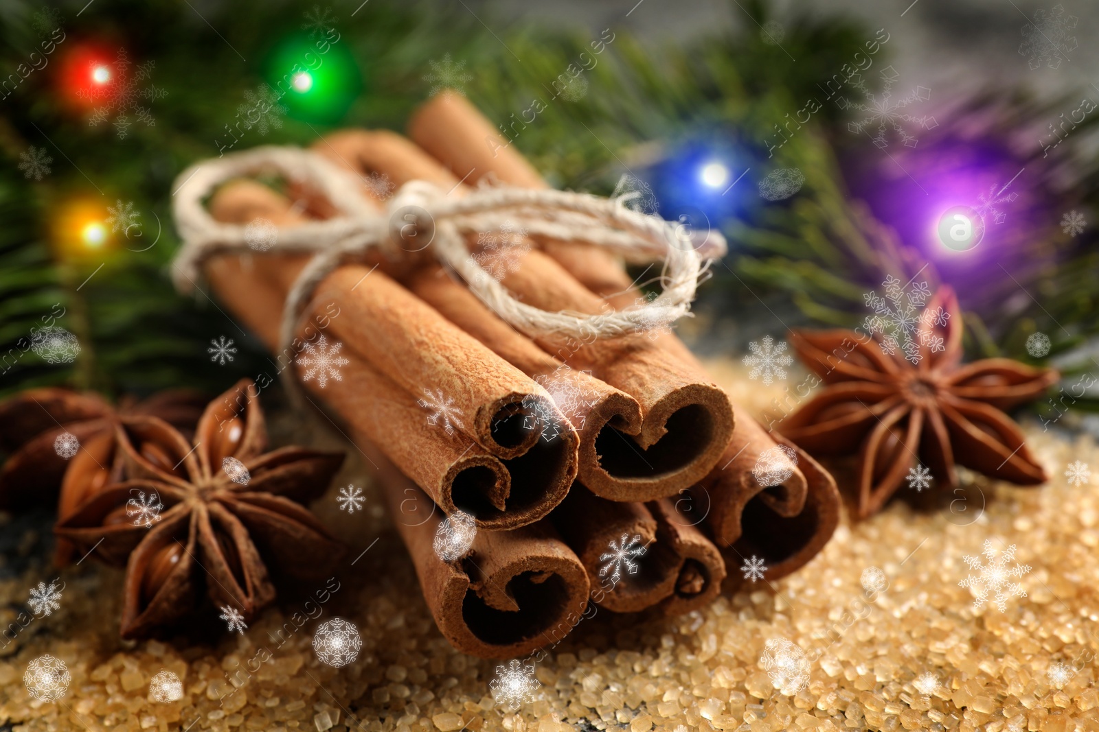 Image of Different spices and fir tree branches on brown sugar, closeup. Cinnamon, anise, brown sugar