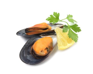 Delicious cooked mussels with parsley and lemon on white background