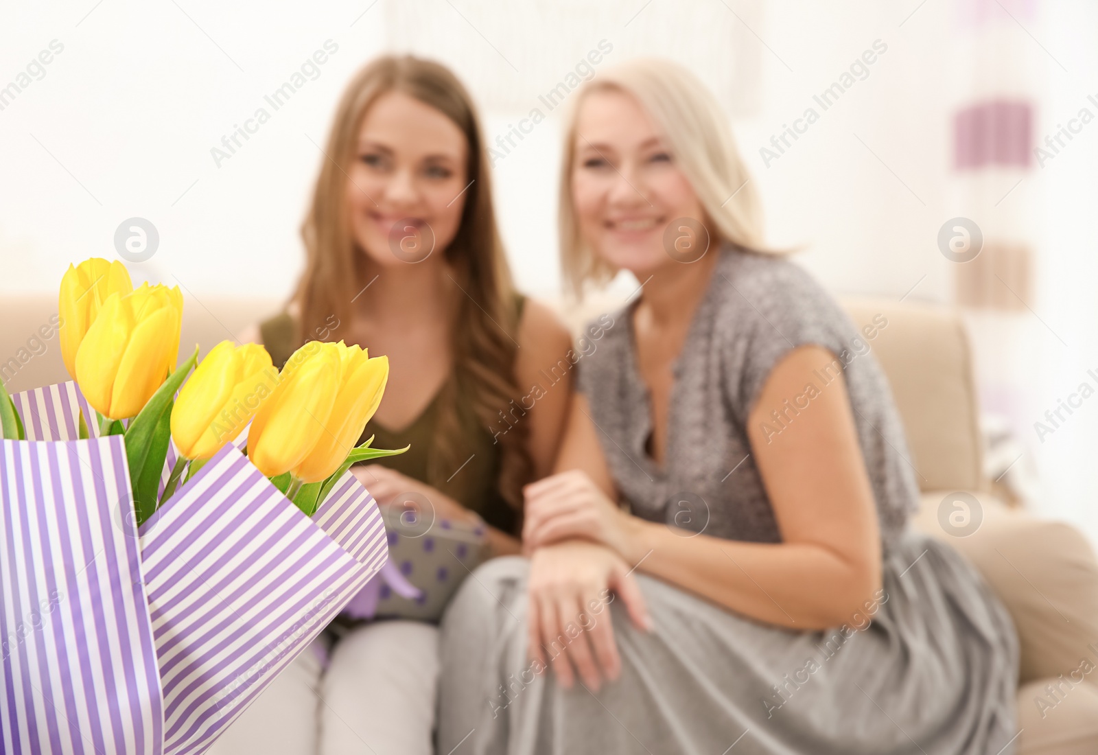 Photo of Congratulating happy women with holiday at home