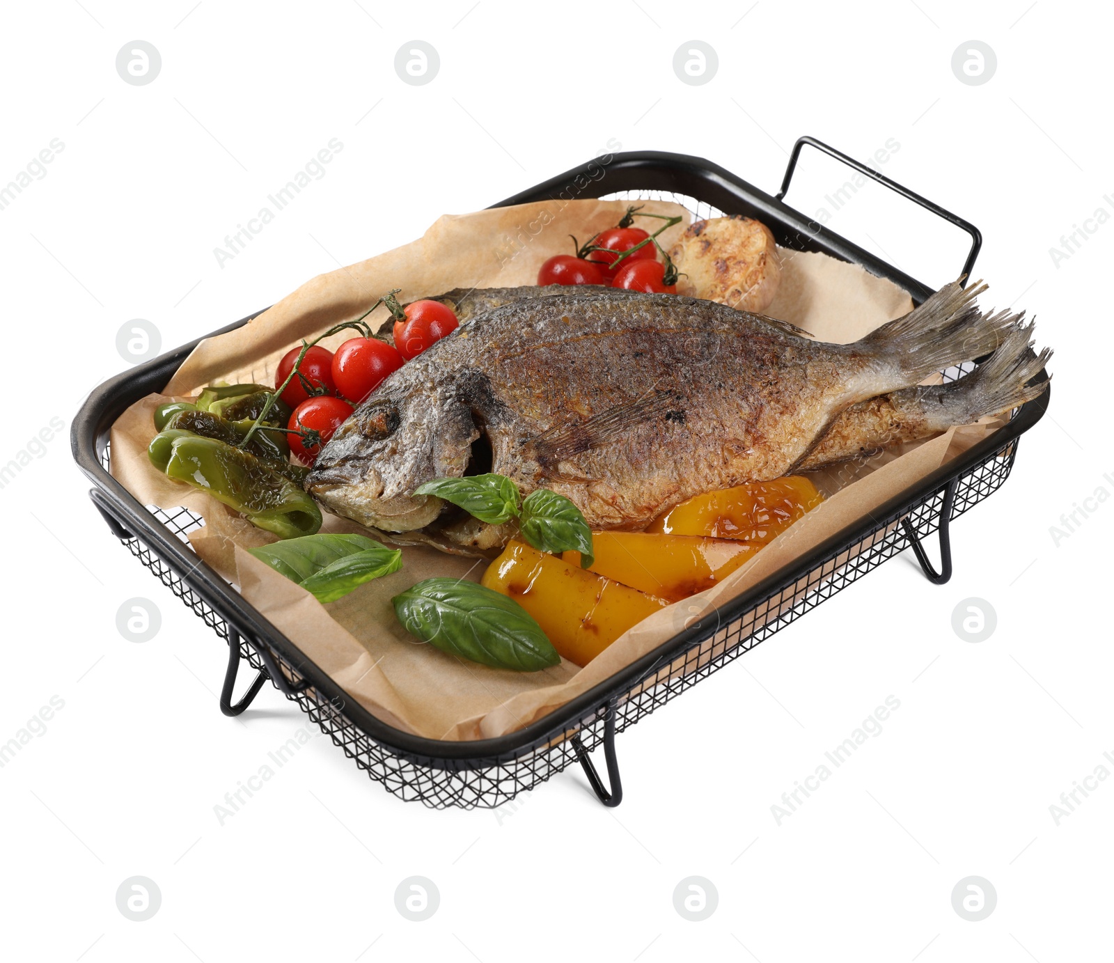 Photo of Delicious roasted dorado fish with vegetables and basil isolated on white