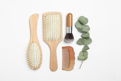 Photo of Composition with hair comb and brushes on white background, top view