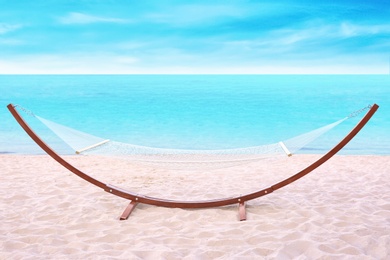 Photo of Empty hammock at seaside. Time to relax