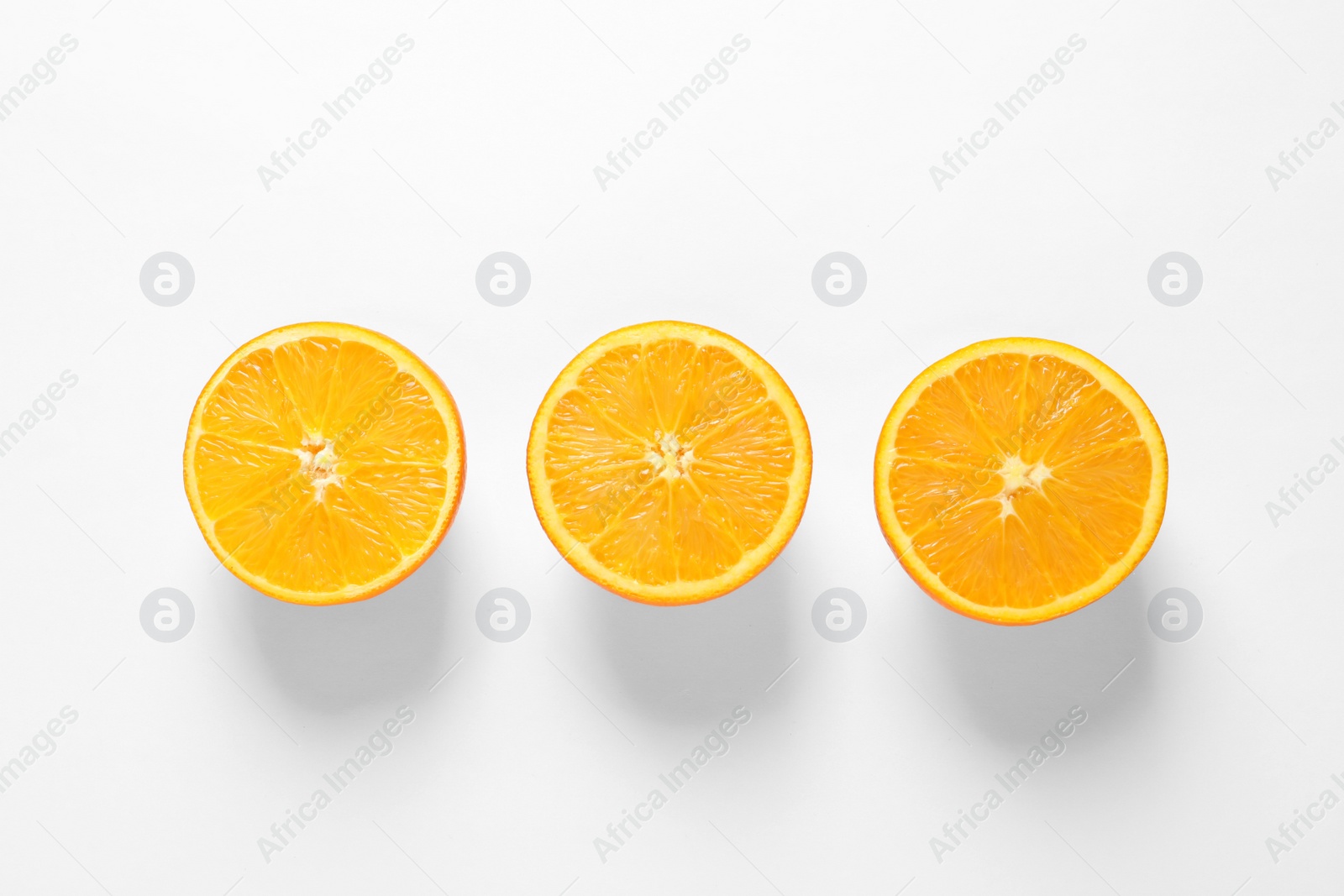 Photo of Juicy oranges on white background, top view