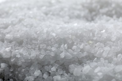 Photo of White natural salt as background, closeup view