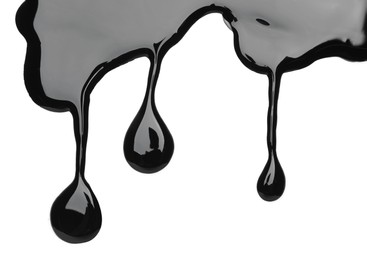 Photo of Black glossy paint spilled on white background, top view