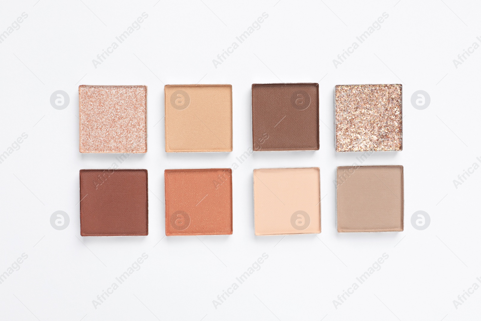 Photo of Beautiful eye shadow refill pans on white background, flat lay