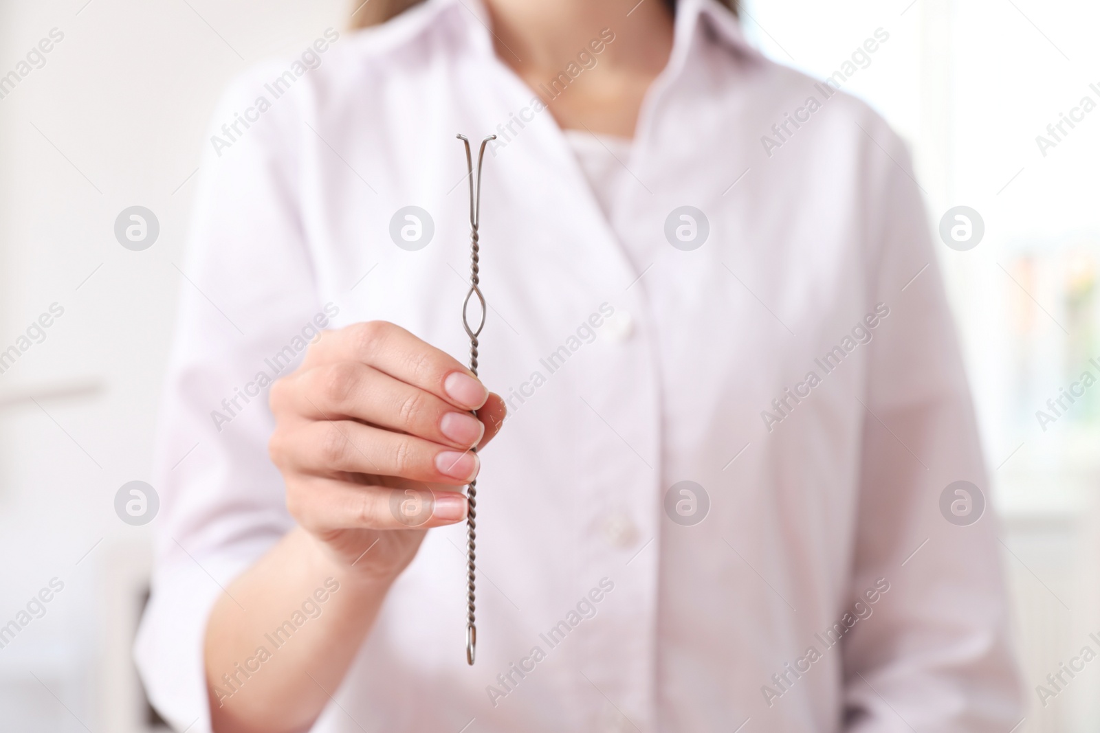 Photo of Speech therapist with logopedic probe in clinic, closeup. Space for text