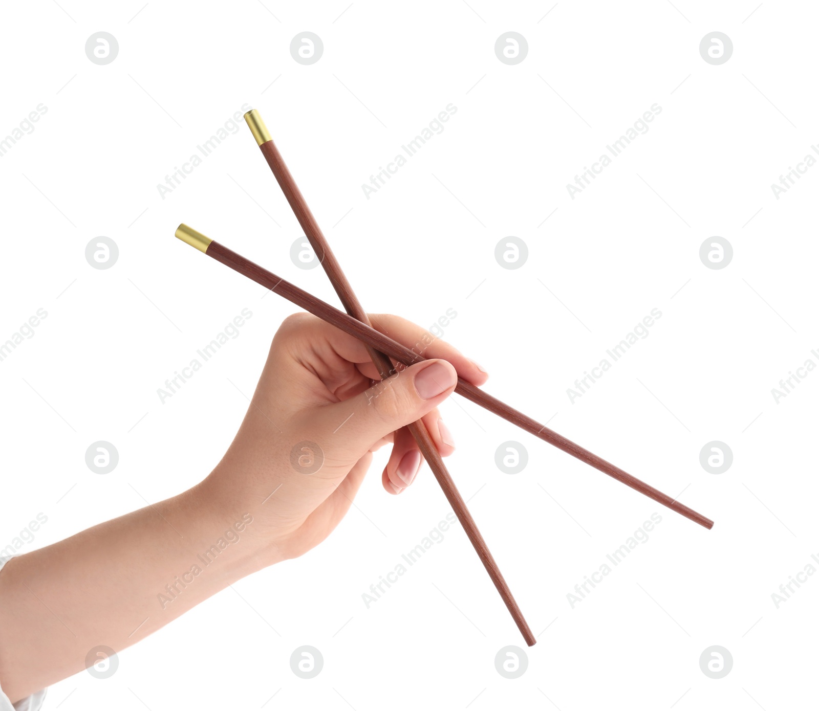 Photo of Woman holding pair of wooden chopsticks on white background, closeup